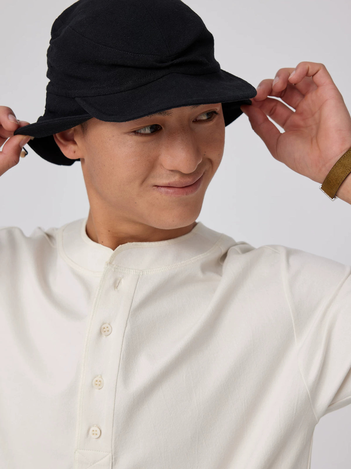 Simple Project Ruched Cotton Linen Hunter Cap - Black adjusting the brim front view